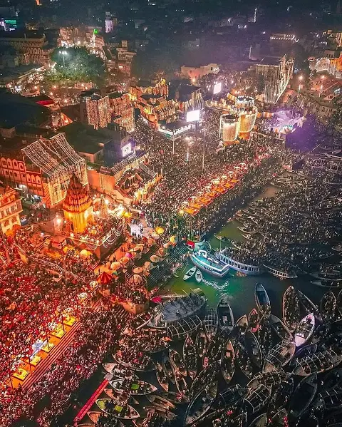 The whole riverfront lit for Dev Deepawali, every ghat picked out in gold above the moored boats