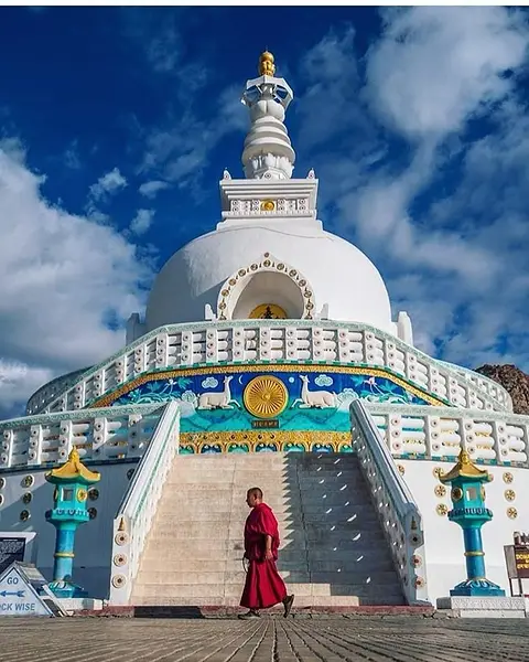 The white Shanti Stupa above Leh under a deep blue sky